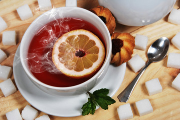 homemade marmalade cookies and sweet forest fruit tea with lemon for the afternoon with mum