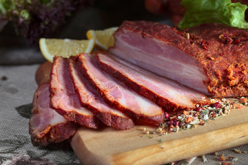 Smoked meat with spices and lemon .