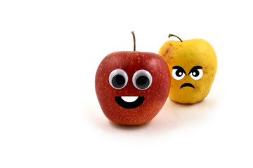 Happy and angry apples with googly eyes stock images. Fresh and overripe apple photo. Jealous...