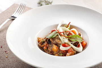 salad of stewed vegetables on a white wooden background