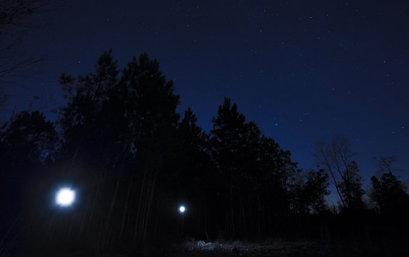 Flashlights on a starry night