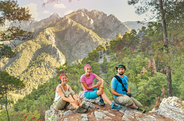 Young friends with backpacks enjoying view, traveling in canyon at Lycian Way