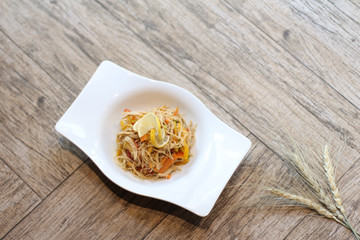 Chicken salad on a wooden background