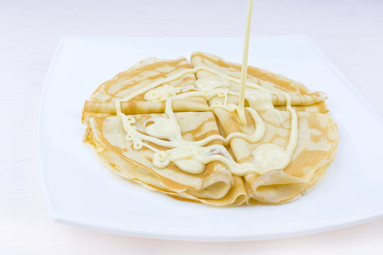 Pancakes drenched with condensed milk