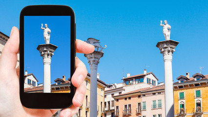 tourist photographs column on Piazza dei Signori