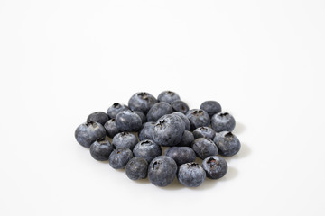 Blueberries in a white backgorund composition