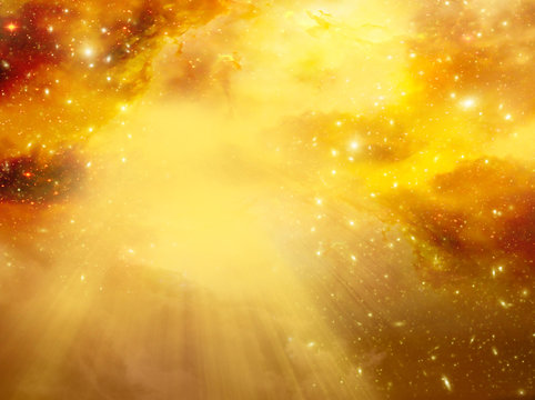 mystical divine angelic sky background with divine light and stars in yellow gold orange colors 
