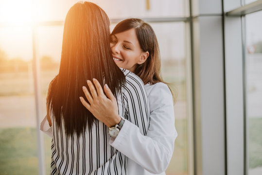 Caring Young Medical Doctor Hugging Patient.