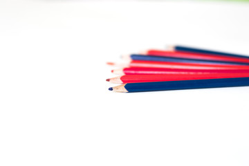 colored pencils lying on white