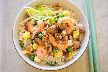 Fried rice with char sui pork, prawns, egg and vegetables with sesame oil 
