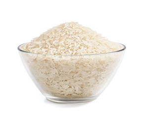 Heap of parboiled rice in glass bowl isolated on white background. Close up, high resolution product. Healthy food.
