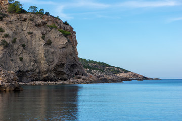 Fototapeta premium The coast on a blue day in Ibiza