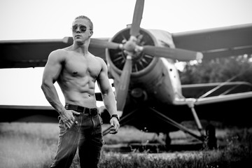 Fototapeta na wymiar A man in front of a airplane.