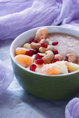 Raw linen cereal with fruits, nuts and honey in bowl. Super food for healthy nutritious breakfast