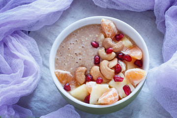 Raw linen cereal with fruits, nuts and honey in bowl. Super food for healthy nutritious breakfast
