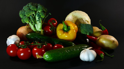 Big set organic food. Fresh raw vegetables. On a black chalkboard.