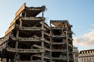 Remains of demolished modern building showing concrete floors