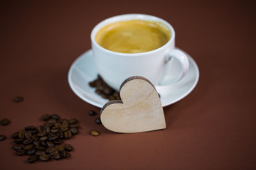 cup of coffee with heart, brown background, invitation, card