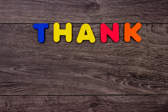Word Thank from wooden letters