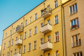 yellow building with small balcony