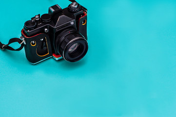 Retro film camera with empty space. Travel concept.