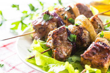 Grilled shish kebab or shashlik on white.