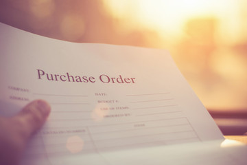 Fill in the purchase items in an order form,Close up of purchase order form with pen / selective...