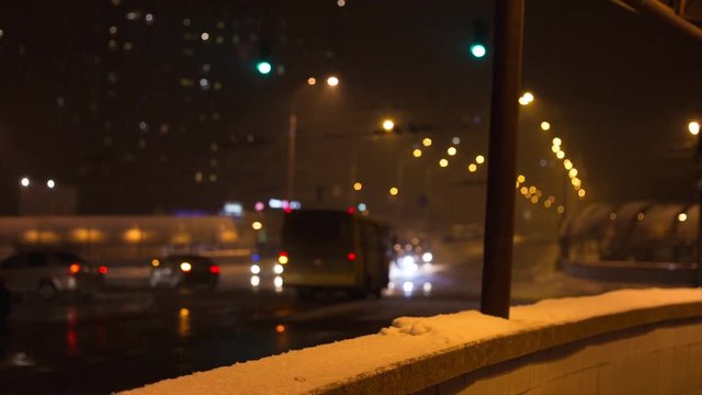 City traffic in winter. Snowfall