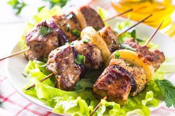 Grilled shish kebab or shashlik on white.