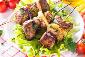 Grilled shish kebab or shashlik on white.