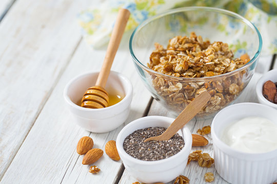 breakfast with granola on wooden surface