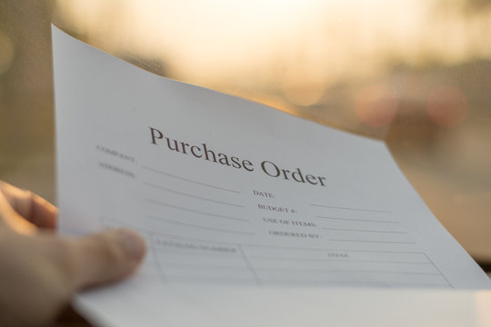 Fill in the purchase items in an order form,Close up of purchase order form with pen / selective focus
