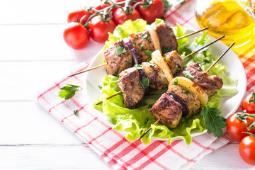 Grilled shish kebab or shashlik on white.