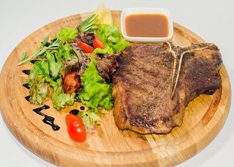 well-fried juicy steak with vegetables