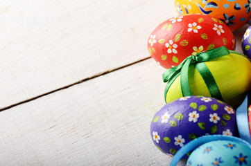 Painted decorated easter eggs on white table