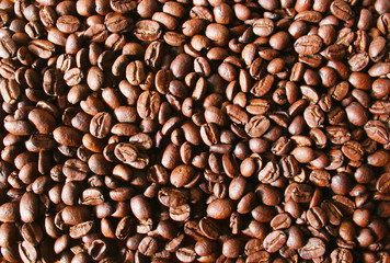 Coffee beans background on a wooden table