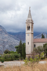 Fototapeta na wymiar Village of Dobrota and St.Eustace's Church on the shore of Kotor Bay. Montenegro. 