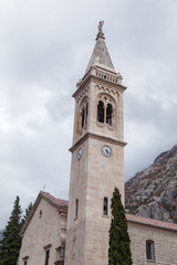Fototapeta na wymiar Village of Dobrota and St.Eustace's Church on the shore of Kotor Bay. Montenegro. 
