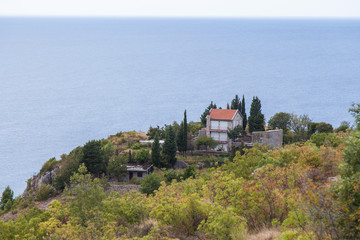 Obraz premium House on a hill on the coast of Montenegro