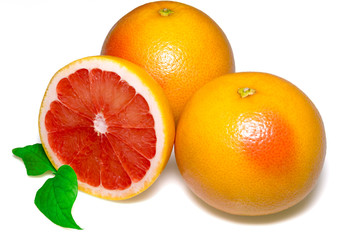 Grapefruit with slice and leafs on white background