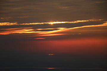 Dramatic bloody red orange colored sky sunset