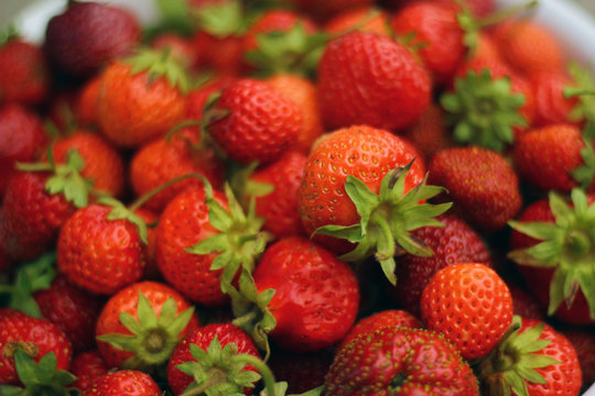 Fresh strawberry as background. Close up, top view, high resolution product