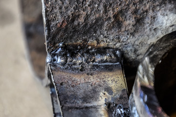 Welding parts racks rods by electric welding. Traces of the use of grinding machines and welding.