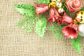 Fototapeta na wymiar Christmas decoration on brown sackcloth background