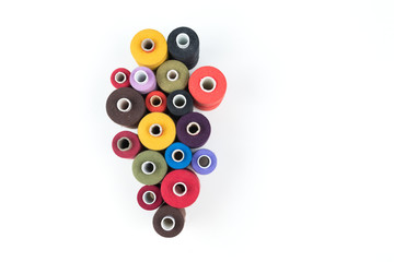 Set of colored thread coils on white background, sewing and tailoring