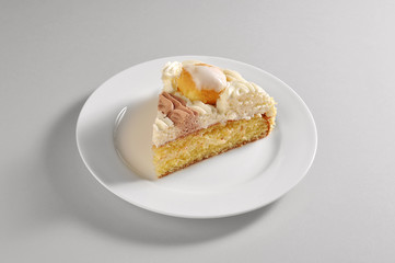 Round dish with slice of saint honorè cake