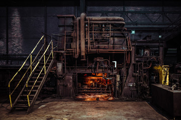 interior of an old abandoned steel factory in western Europe - obrazy, fototapety, plakaty