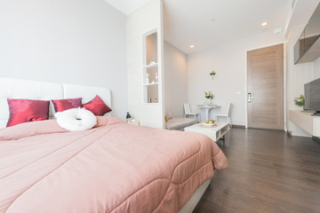 Fototapeta na wymiar Modern bedroom in luxury apartment