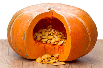 Sliced orange pumpkin with seeds