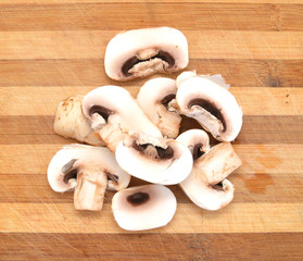 Champignon on wooden background